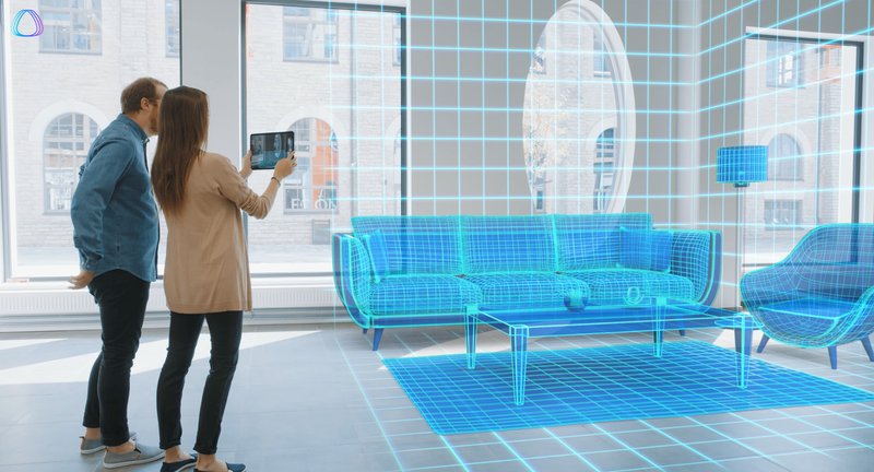 A man and woman placing virtual furniture items in a living room using AR and a tablet.