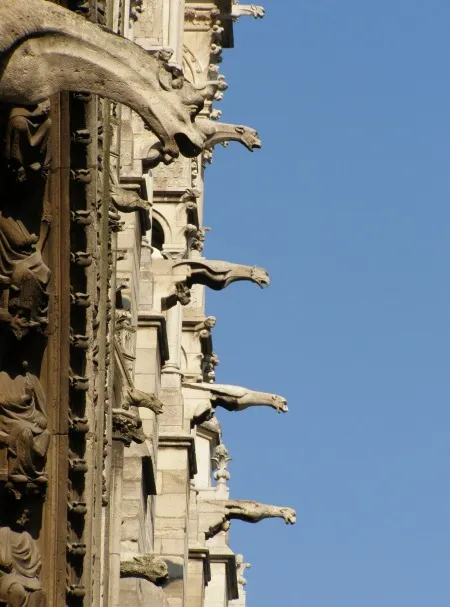 A rA row of stone gargoyles on the side of Notre-Dame Cathedral