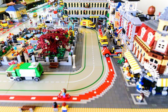 Intricate LEGO cityscape with detailed streets, buildings, and vehicles.