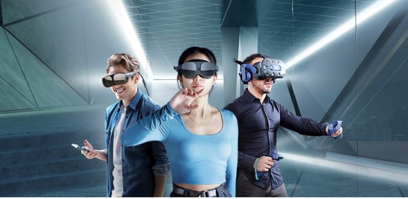 Two men and a woman wearing VIVE VR headsets