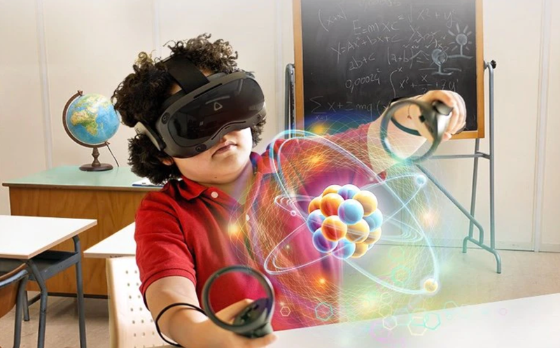 Child in classroom examining 3D model of an atom with VIVE Focus 3 all-in-one VR headset