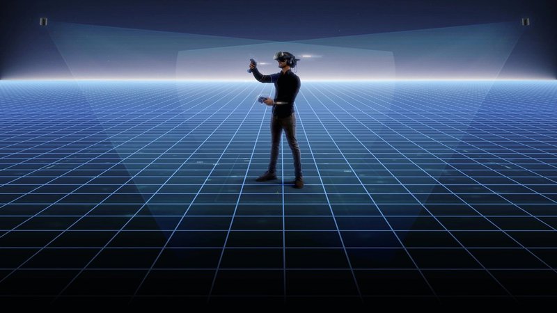 vive-base-stations-tracking-the-location-of-man-using-a-vr-headset-and-two-vr-controllers.jpg